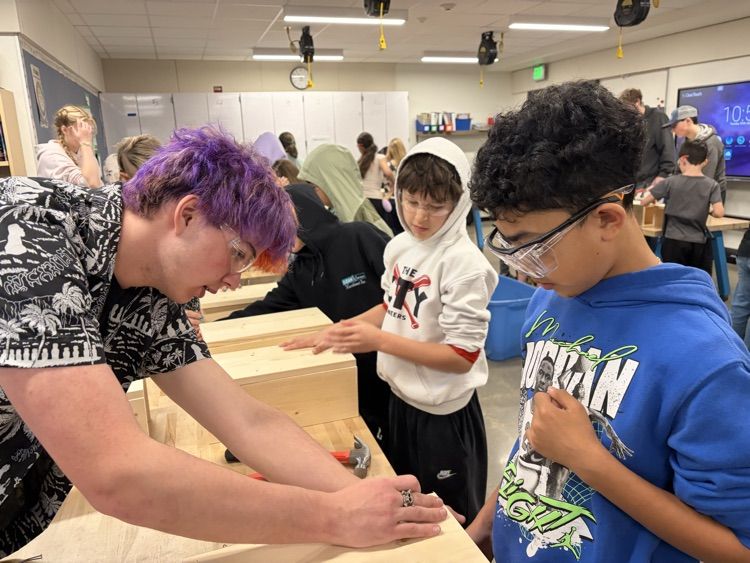 CAIS students helped 5th graders make tool boxes.