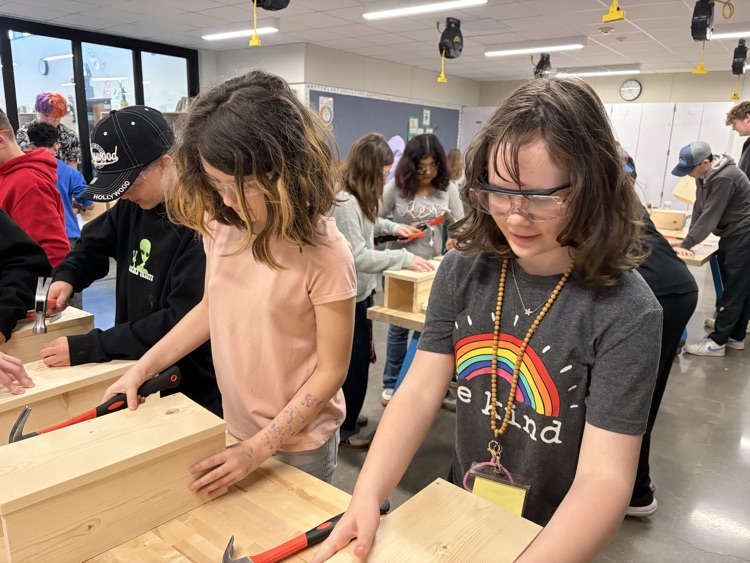 CAIS students helped 5th graders make tool boxes.