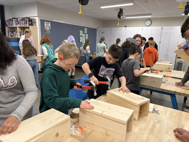 CAIS students helped 5th graders make tool boxes.