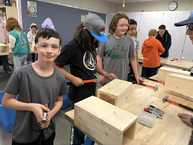 CAIS students helped 5th graders make tool boxes.