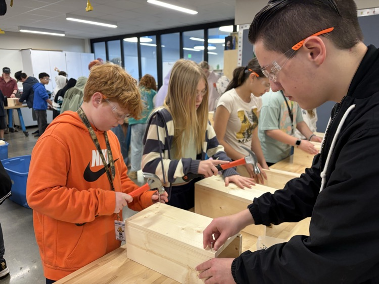 CAIS students helped 5th graders make tool boxes.