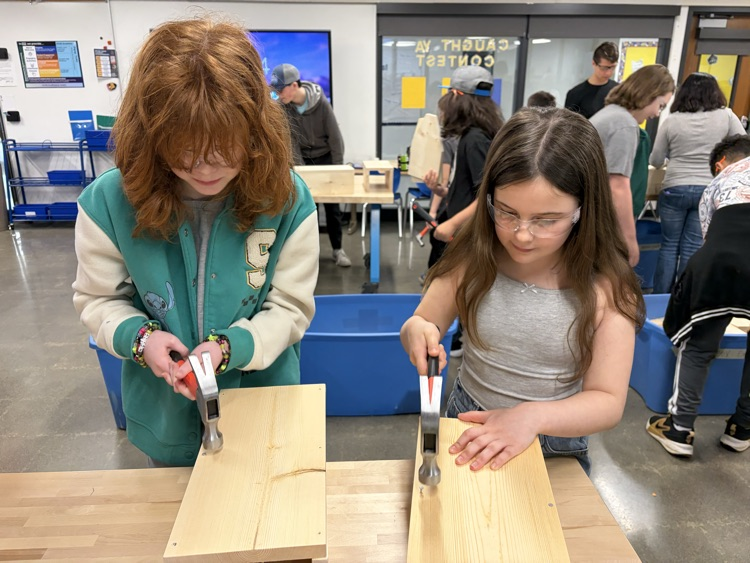 CAIS students helped 5th graders make tool boxes.