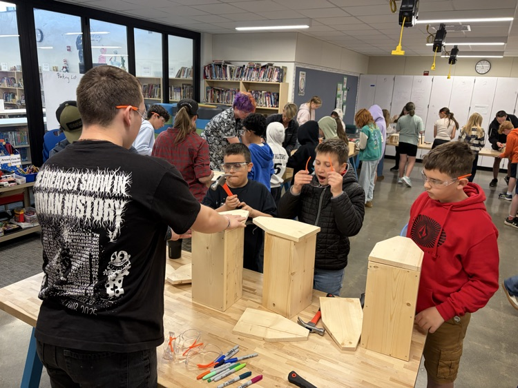 CAIS students helped 5th graders make tool boxes.