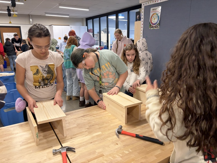 CAIS students helped 5th graders make tool boxes.