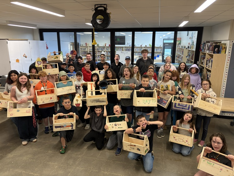 CAIS students helped 5th graders make tool boxes.