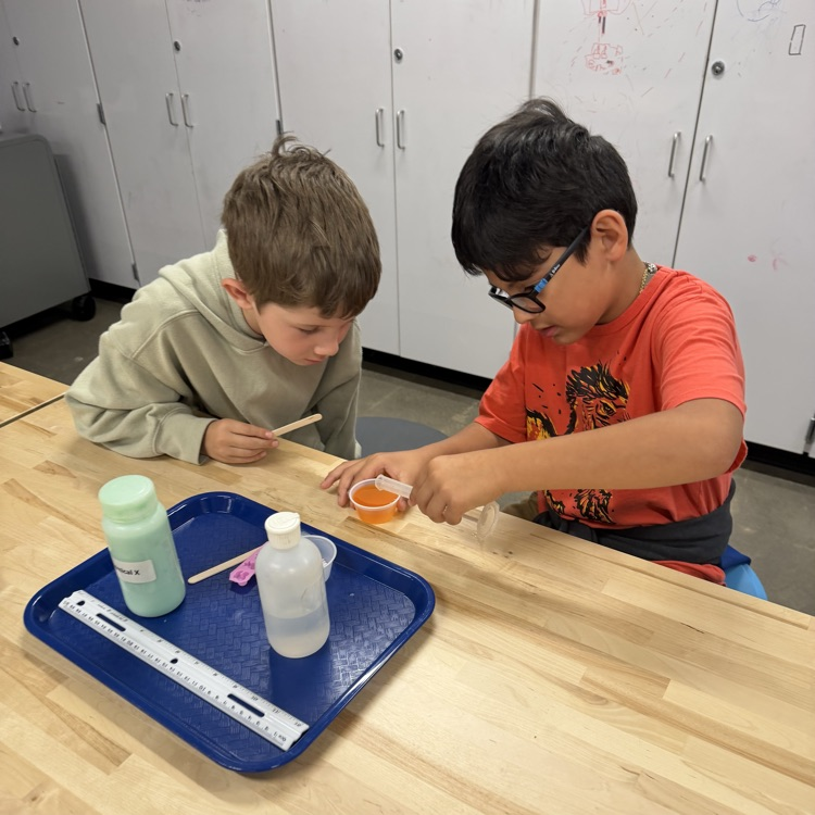 Students perform beginner chemistry.