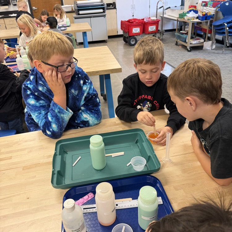 Students perform beginner chemistry.