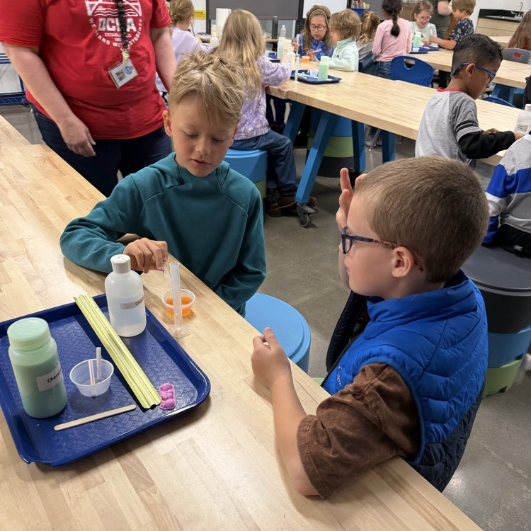 Students perform beginner chemistry.