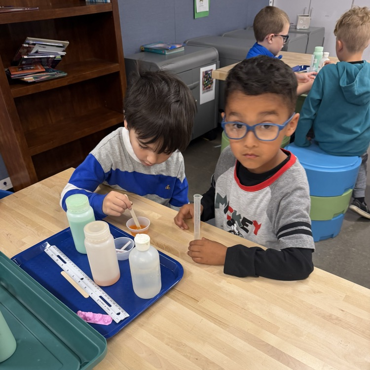 Students perform beginner chemistry.
