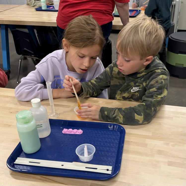 Students perform beginner chemistry.