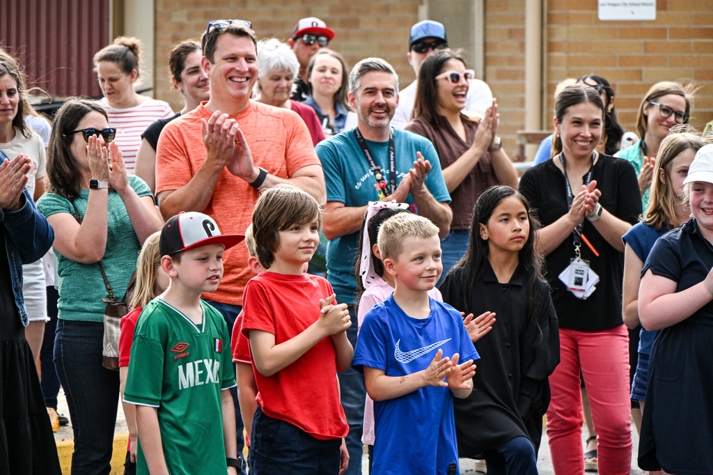 Candy Lane parents, staff, and students applaud and smile during the groundbreaking ceremony.