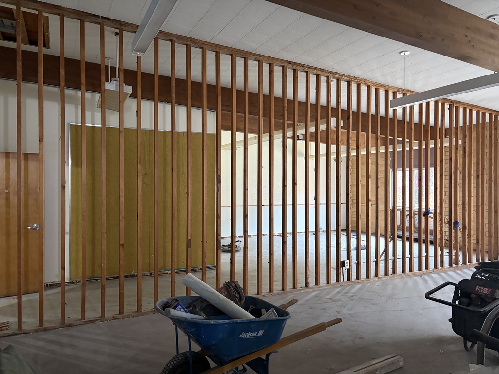 Construction area showing a new wall being constructed.