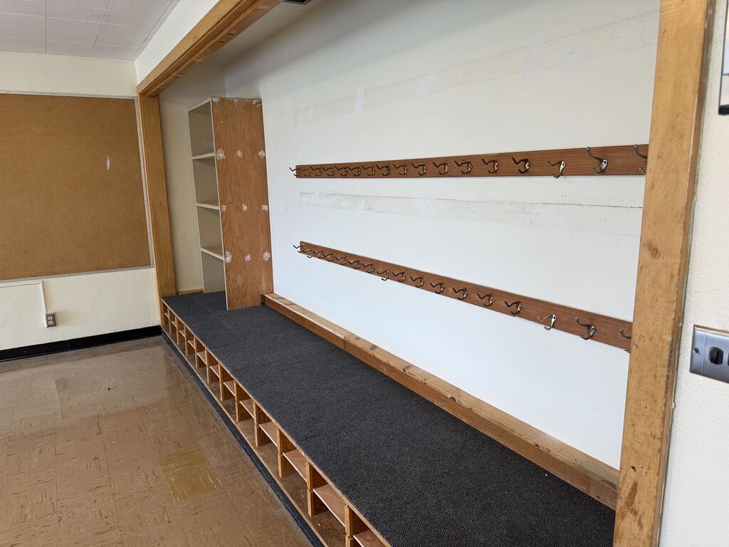 Classroom with coat hooks and shelving.