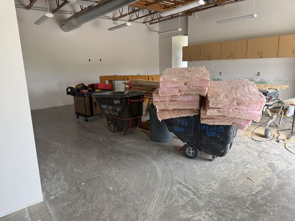 Room with construction equipment and insulation.
