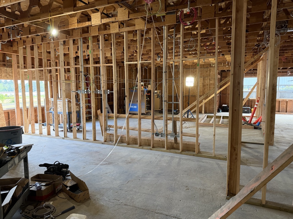 An empty room under constrution showing wood framing.