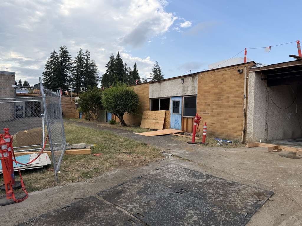 Outside of the building showing where the wall has been cut away creating another classroom.