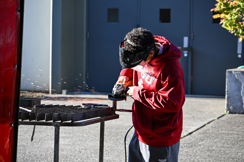 CAIS Student grinding metal