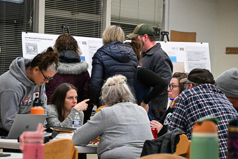 EDAG members reviewing and discussing conceptual designs