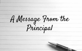 A message from the principal written on lined paper