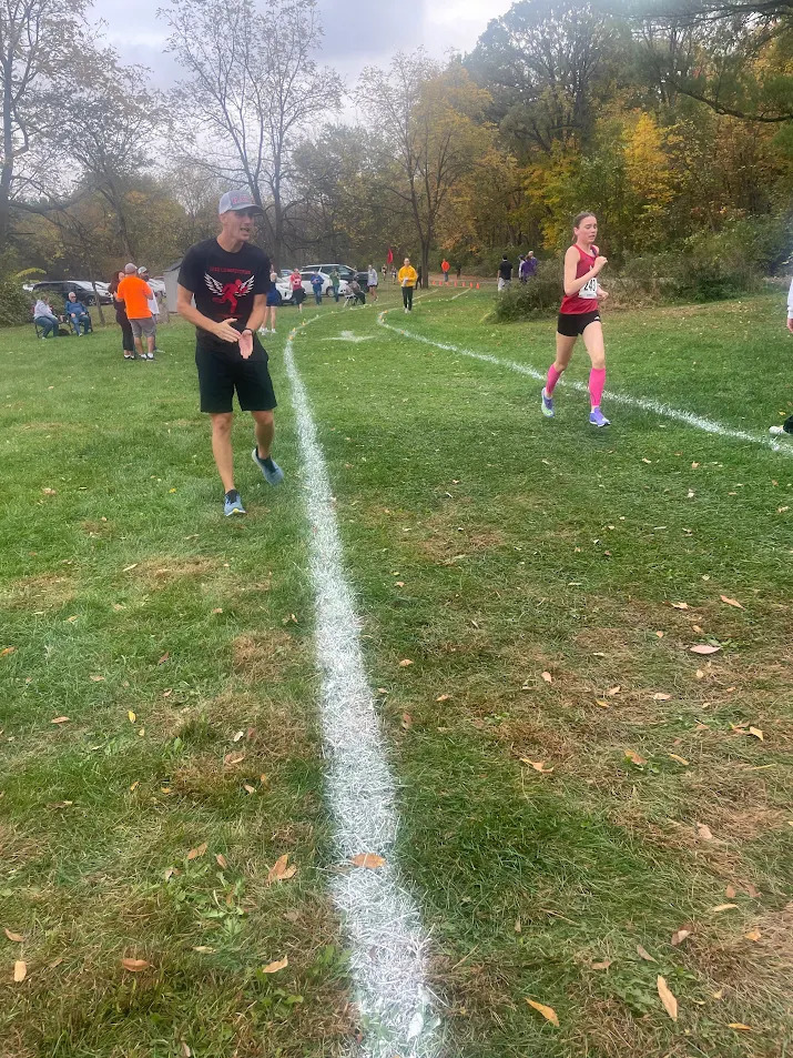 Coach Poser Supporting His Team