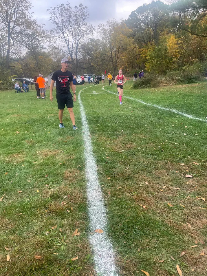 Coach Poser Supporting His Team