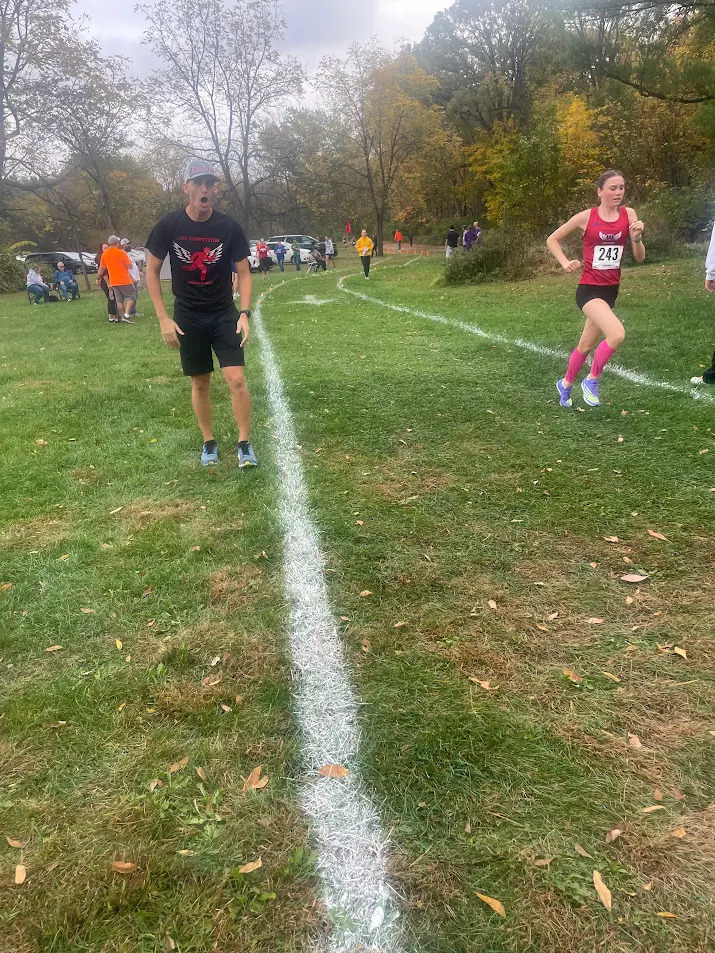 Coach Poser Supporting His Team