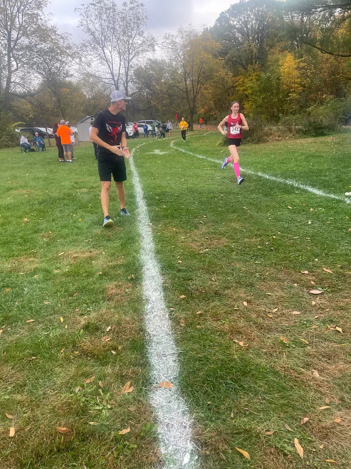 Coach Poser Supporting His Team