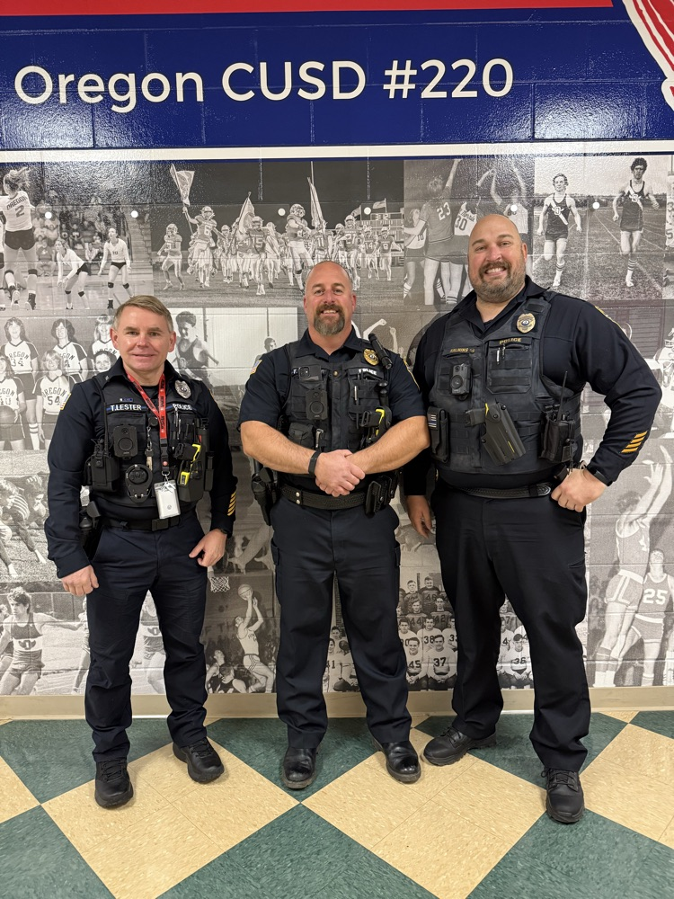 Officer Lester, Lt. Brechon, Chief Kalnins posing for a photo
