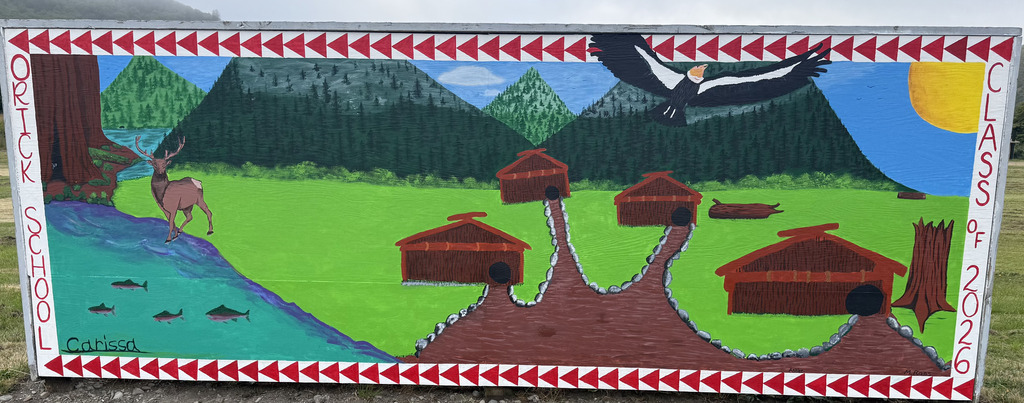 image of the mural created by Carissa Gonzalez. It depicts a yurok village next to the river with a California Condor and Roosevelt Elk.