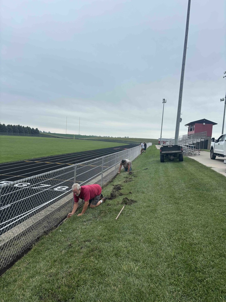Custodians installing edging