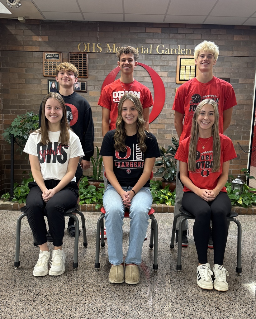 three girls sitting on chairs in front of three boys
