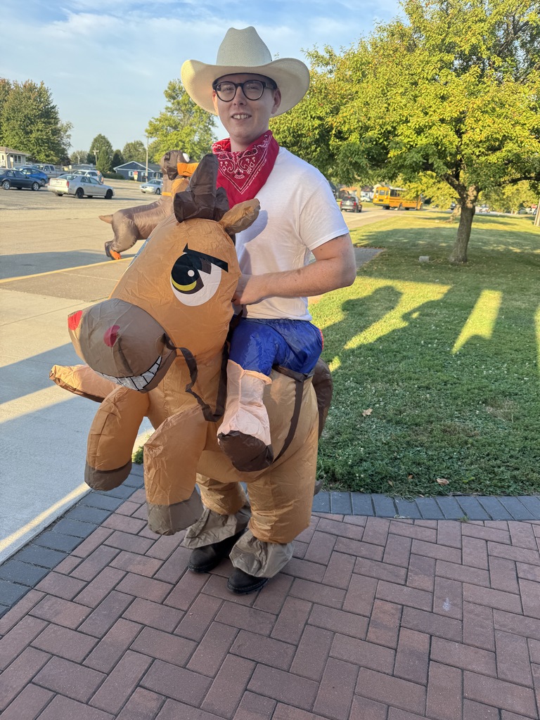 a teacher in a cowboy inflatable