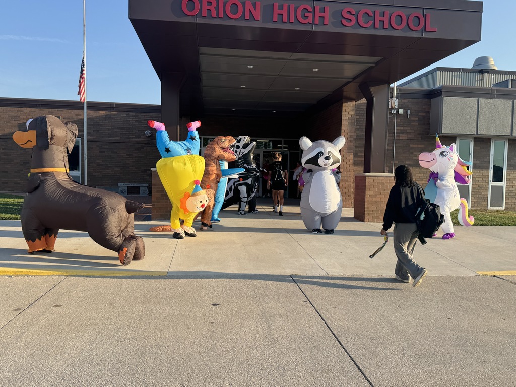 students walk through a crowd of inflatables