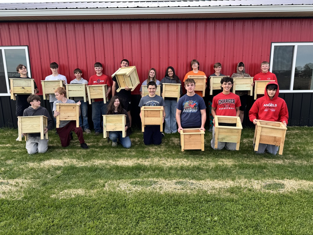 students with planter boxes