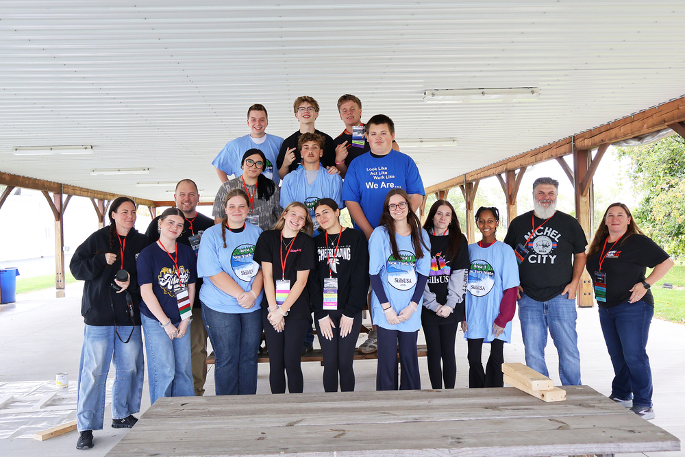SkillsUSA students and advisors posing under pavilion 