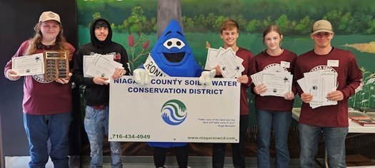 Five students with water county mascot show off certificates