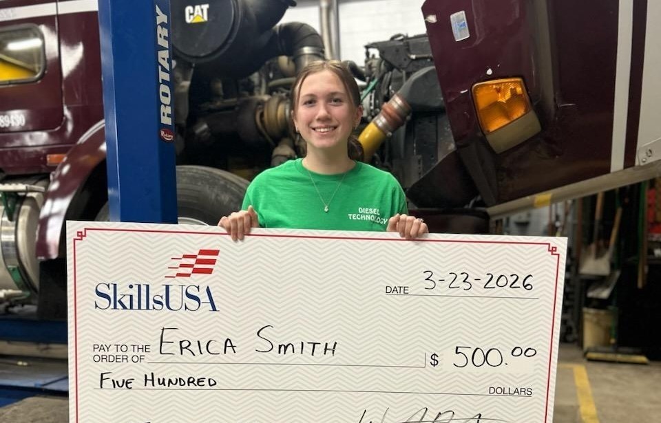 Student holding oversized check