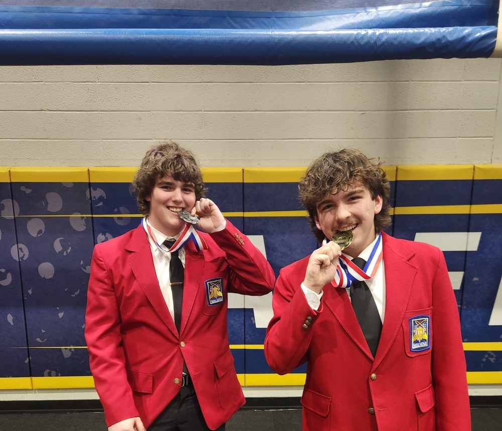 Two students with medals