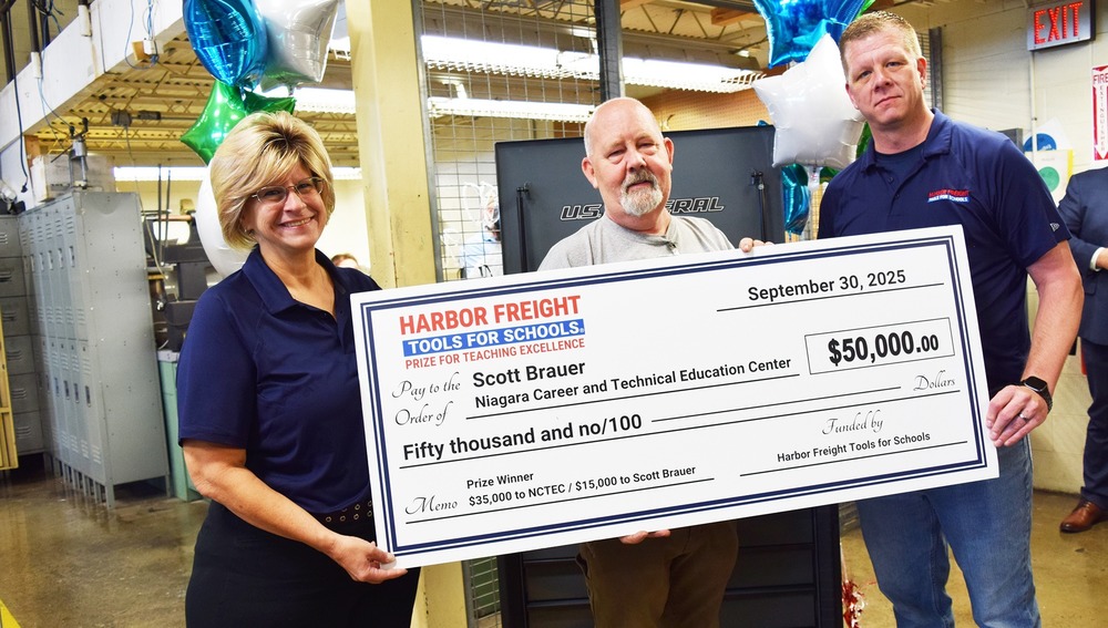 Woman and two men hold oversized check from Harbor Freight Tools for Schools