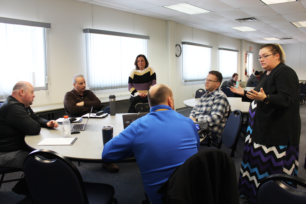 Group of educators having a discussion at table