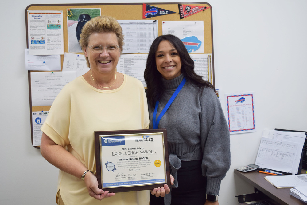Two women holding certificate