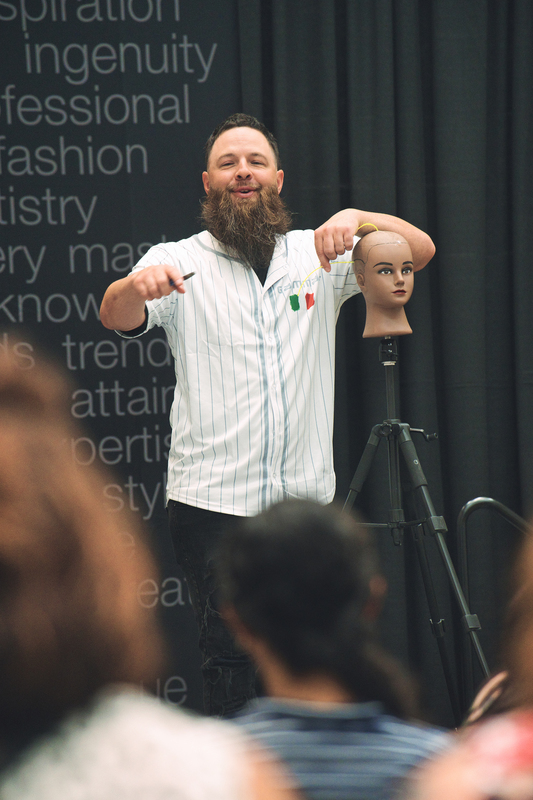 Man working on hair manniquin
