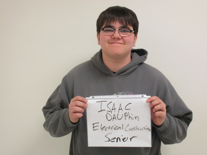 Student holding a sign with his career intention to be an electrician