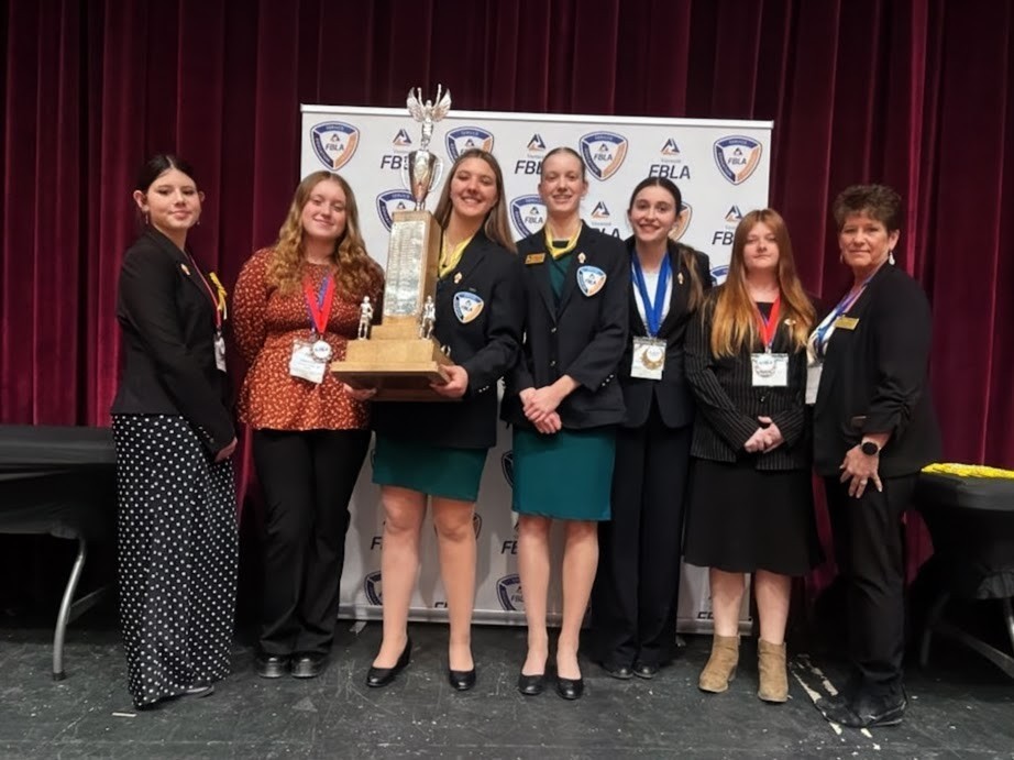 FBLA Students Holding Trophy