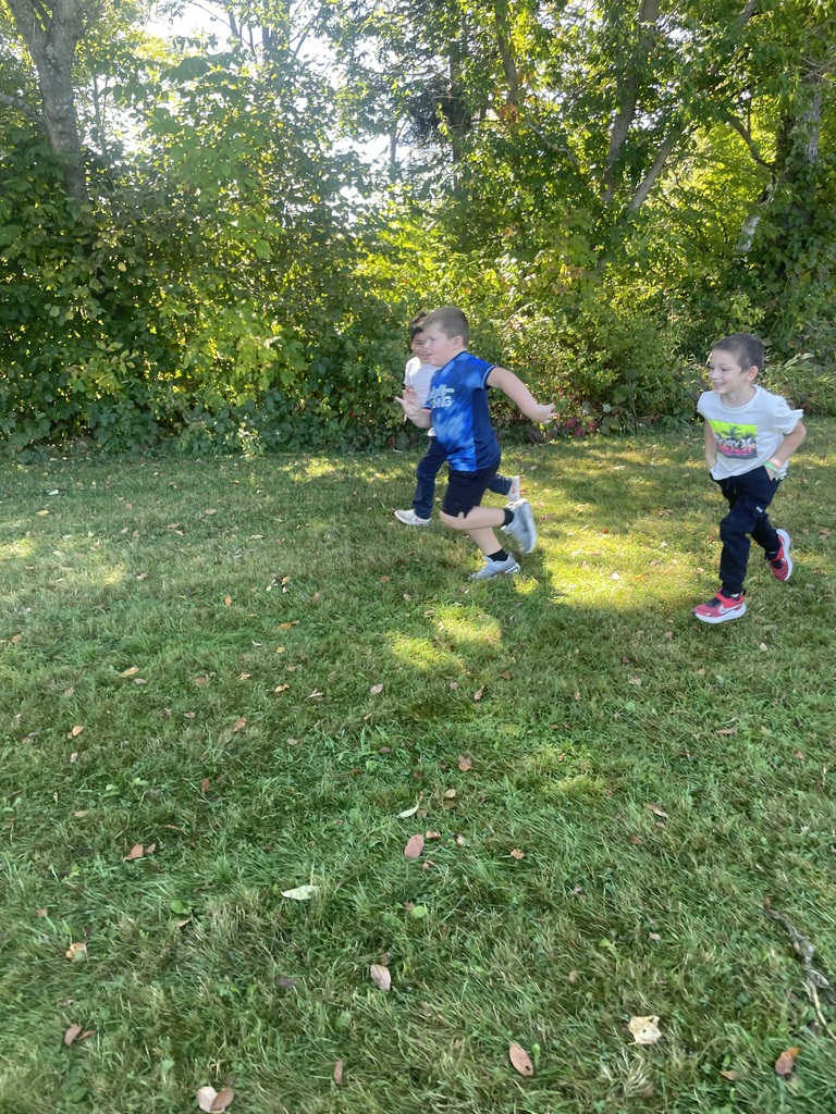 students running in the grass
