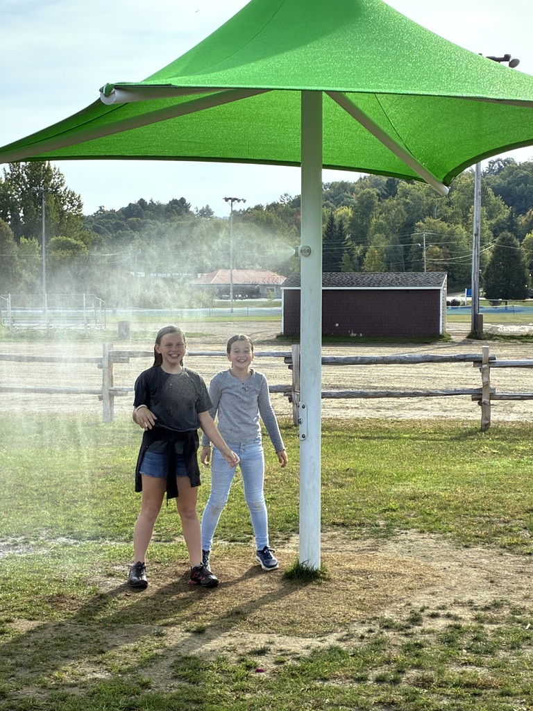 5th graders under the water spray