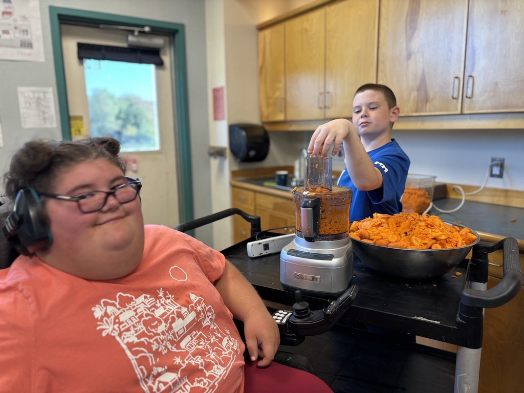 students prepping and eating carrots