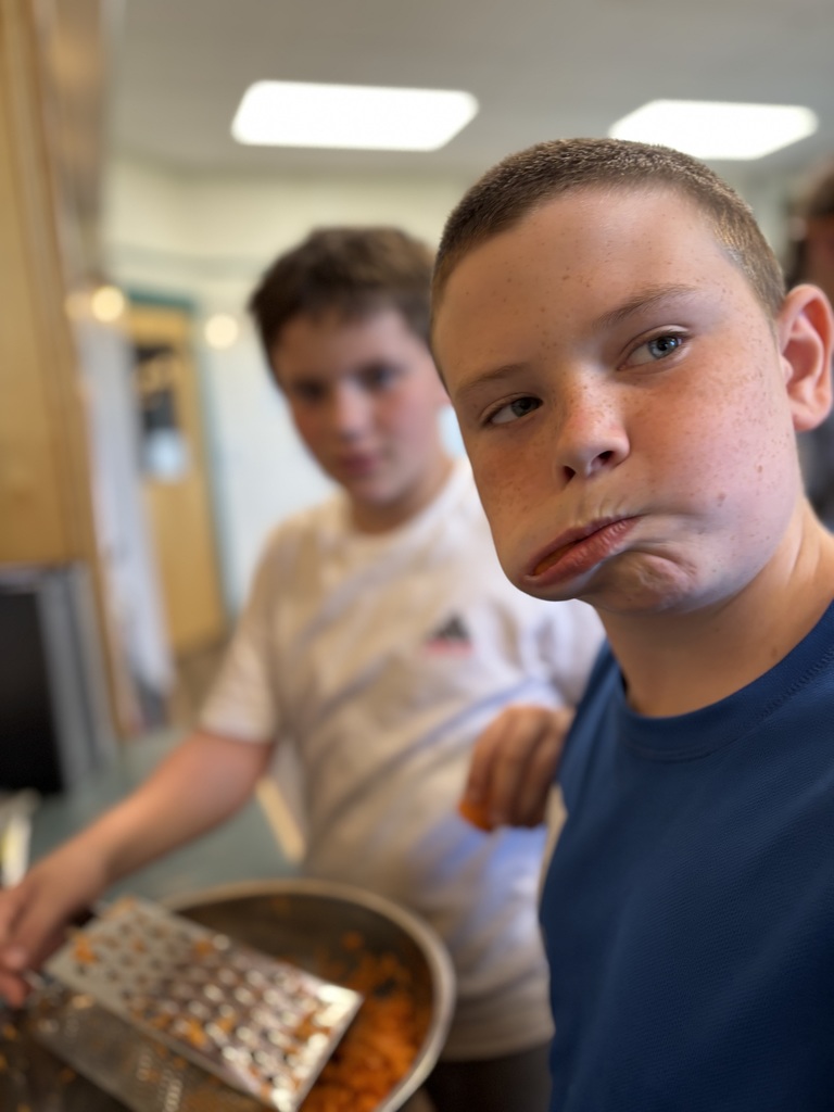 students prepping and eating carrots