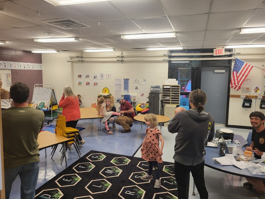 students and families exploring the classrooms at open house