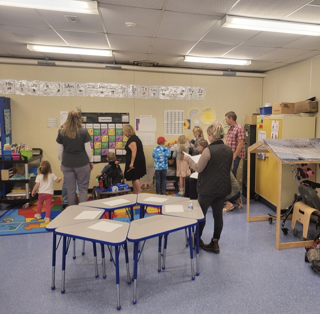 students and families exploring the classrooms for open house